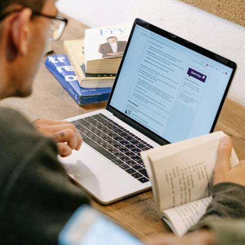 man reviewing search results on a computer